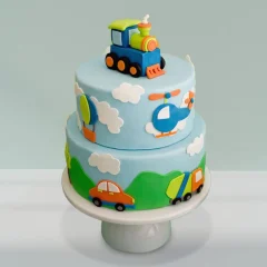 Colorful Two-Tiered Car Adventure Cake with vehicle design for kids’ birthdays at LallanTop Cake Shop, available for delivery in Noida, Ghaziabad, East Delhi, and South East Delhi