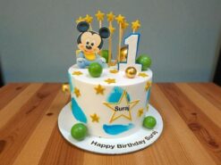 Adorable Mickey Mouse Toddler Star Cake with stars and "1" candle by Lallantop Cake Shop