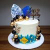 Artistic Custom Wave Cake 2.0 kg with blue and white frosting and edible pearls, best themed cake from Lallantop Cake Shop in Noida and Delhi.