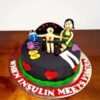 Bold & Playful Couple Theme Cake 2 Bold & Playful Couple Theme Cake with black fondant base, handcrafted couple figurines and red heart accents by Lallantop Cake Shop