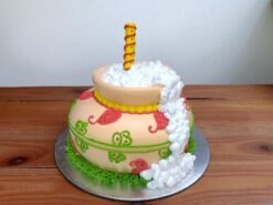 Colorful Matki Birthday Cake with handcrafted matki design, cream overflow, and paisley decorations, made by LallanTop Cake Shop for traditional-themed celebrations in Noida, East Delhi, Indirapuram, Vaishali, Vasundhra, and nearby areas.