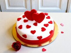 Floating Hearts Fondant Cake with red heart toppers and white fondant finish by Lallantop Cake Shop