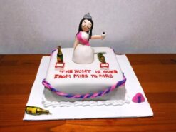 From Miss To Mrs bridal cake with bride figurine and pink accents by Lallantop Cake Shop