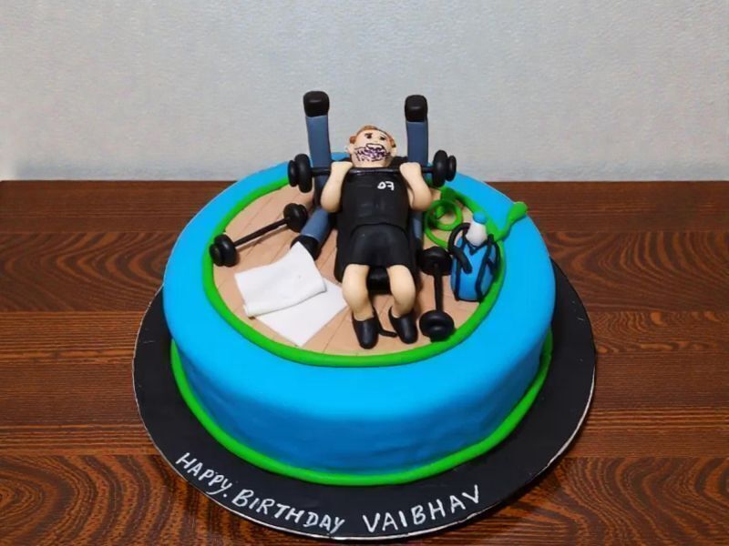 Gymaholic Guy Theme Cake 3 Gymaholic guy theme designer cake with fitness figurine and dumbbells by Lallantop Cake Shop